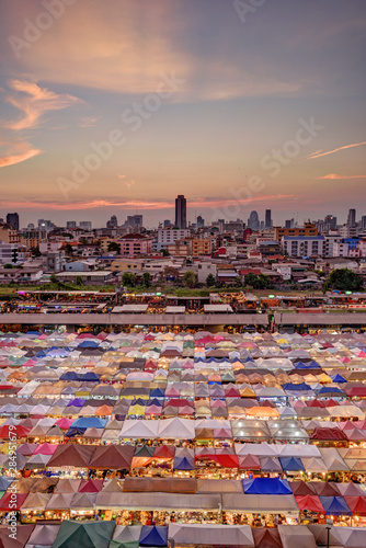 Market with colorful tents in sunset time. This is place in Thailand call Train Market © lcc54613