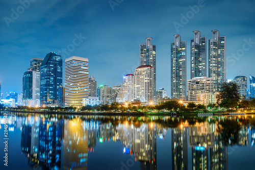 Bangkok city night skyline view in the business district with lake water reflection , Bangkok , Thailand © jaboo_foto