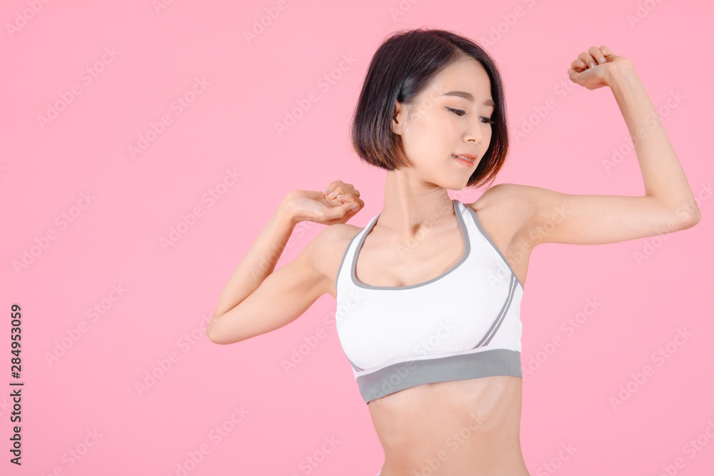 sport woman standing warm-up and stretch body before doing exercise on pink backgrounds, fitness concept, sport concept