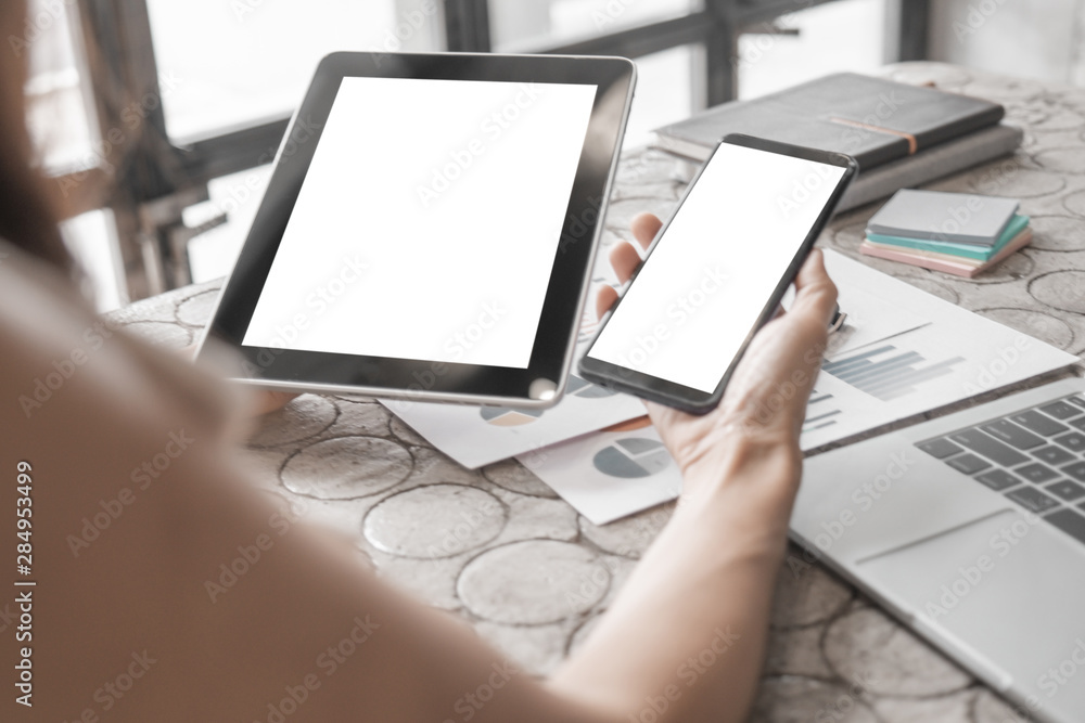 Mockup image of close up business woman working with smartphone tablet and documents in office, mockup concept