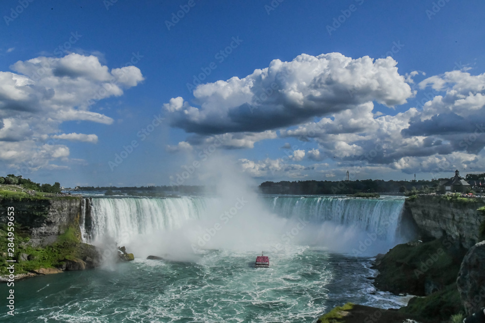 Horseshoe Falls, also known as Canadian Falls, is the largest of the three waterfalls that collectively form Niagara Falls on the Niagara River along the Canada–United States Horseshoe Falls, also known as Canadian Falls, is the largest of the three waterfalls that collectively form Niagara Falls on the Niagara River along the Canada–United States