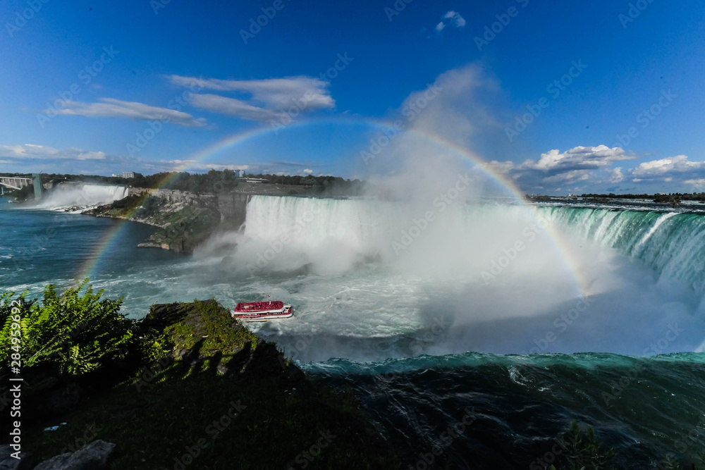 Horseshoe Falls, also known as Canadian Falls, is the largest of the three waterfalls that collectively form Niagara Falls on the Niagara River along the Canada–United States Horseshoe Falls, also known as Canadian Falls, is the largest of the three waterfalls that collectively form Niagara Falls on the Niagara River along the Canada–United States