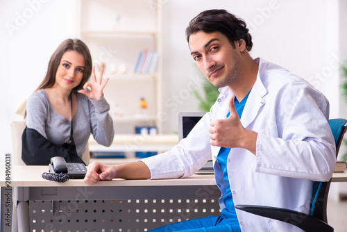 Young male doctor and female beautiful patient