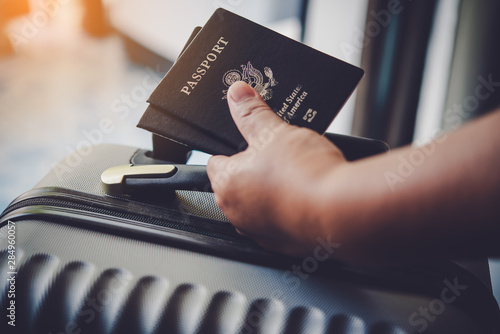 Foto People holding passports, map for travel with luggage for the trip