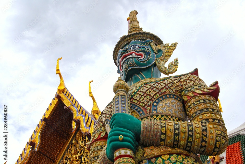 Fototapeta premium The giant guard in front of the temple entrance gate. Traditional art of Thailand.
