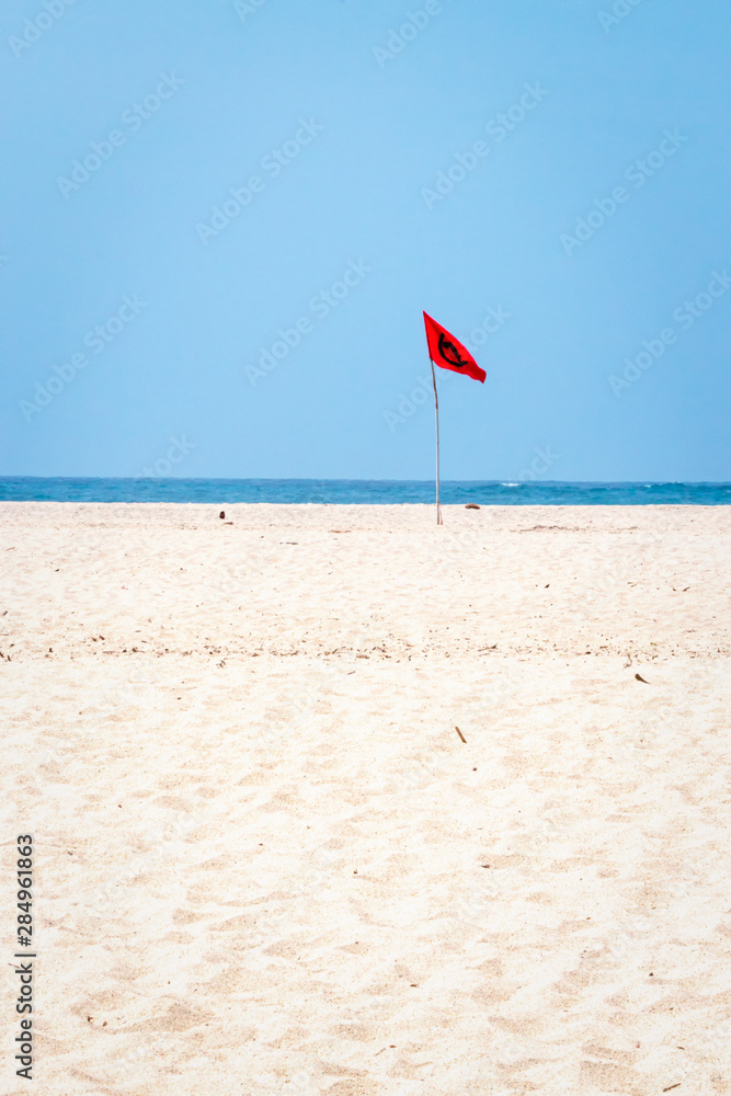 Red flag warning danger on a beach Red flag warning danger on a beach