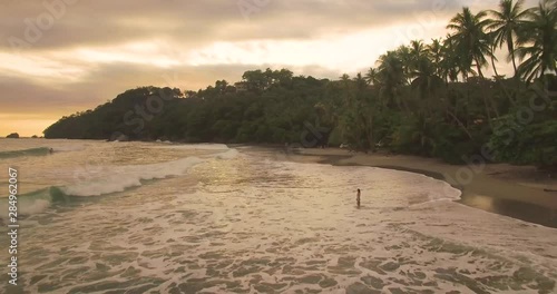 Manuel Antonio Beach Aerial Video in Costa Rica.  Beautiful ocean waves.  IN this serious you'll find all things thoughts about a tropical beach in paradise.  Surfers included photo