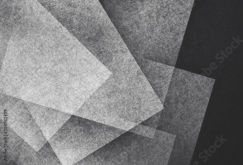 black and white abstract background with angled blocks, squares, diamonds, rectangle and triangle shapes layered in abstract modern art style background pattern, textured background