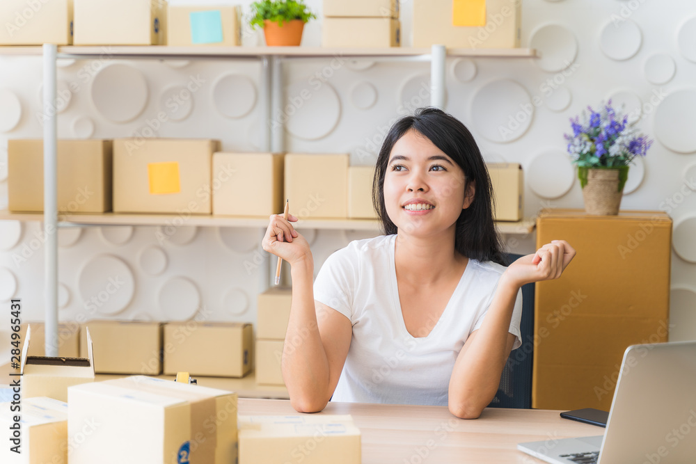 Asian freelance woman working at home and start up small business entrepreneur SME with internet online. Young women feel happy and joy with doing business online. Asian freelance woman working at home and start up small business entrepreneur SME with internet online. Young women feel happy and joy with doing business online.
