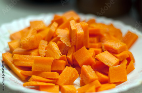 Sliced carrots on a plate close-up, shallow depth of field