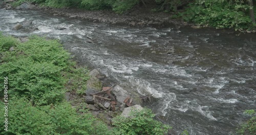 The Wissahickon Creek, high angle, flowing over rocks and stones. photo