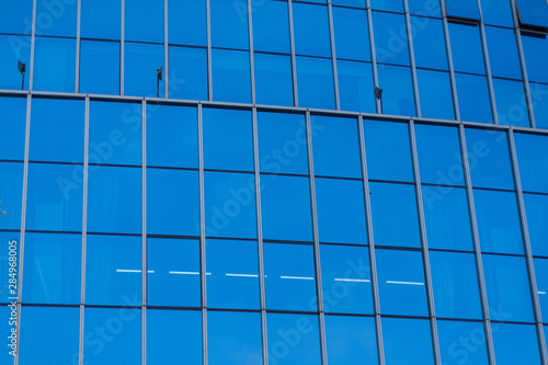 Glass facade of outdoor blue skyscraper