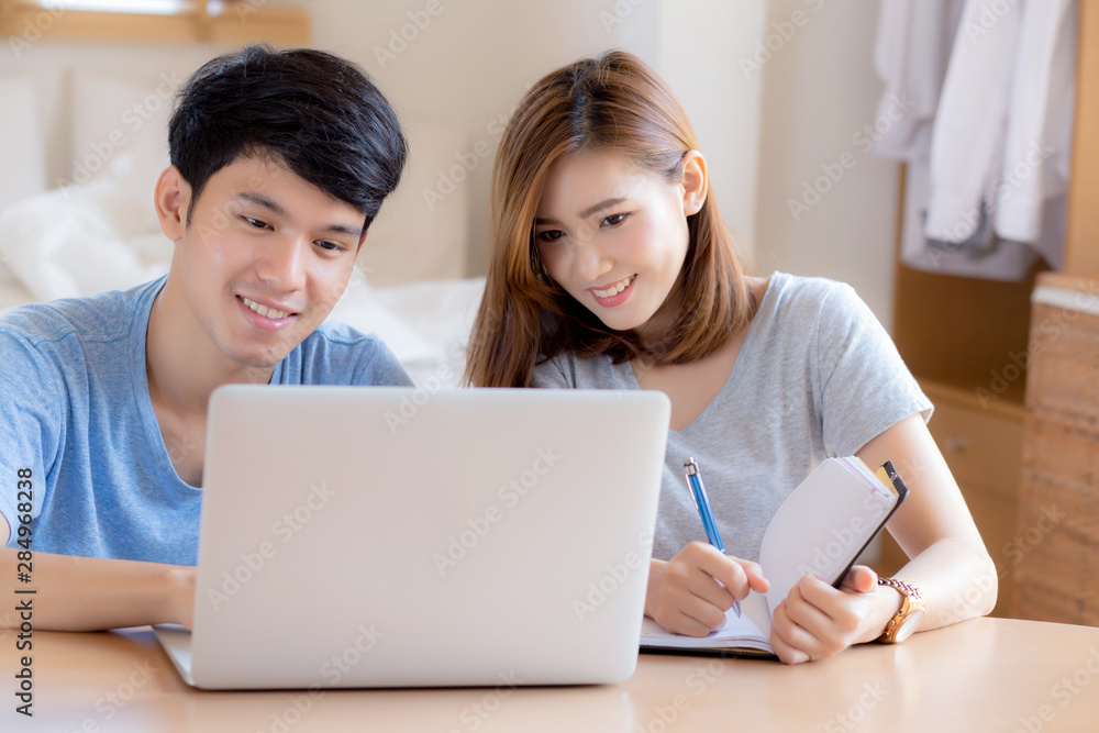 Beautiful young asian couple calculate expenses finance with laptop and planning together, woman writing notebook or note budget household, lifestyle family and business concept. Beautiful young asian couple calculate expenses finance with laptop and planning together, woman writing notebook or note budget household, lifestyle family and business concept.