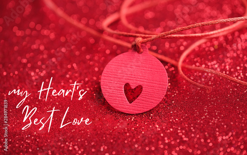 My Heart's Best Love. heart concept on red glitter surface. Love Valentine's Day background. design for Valentine's day greetings. minimalism concept. close up. soft selective focus