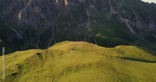 A beautiful sunrise droneshot in the mountains in Italy. photo