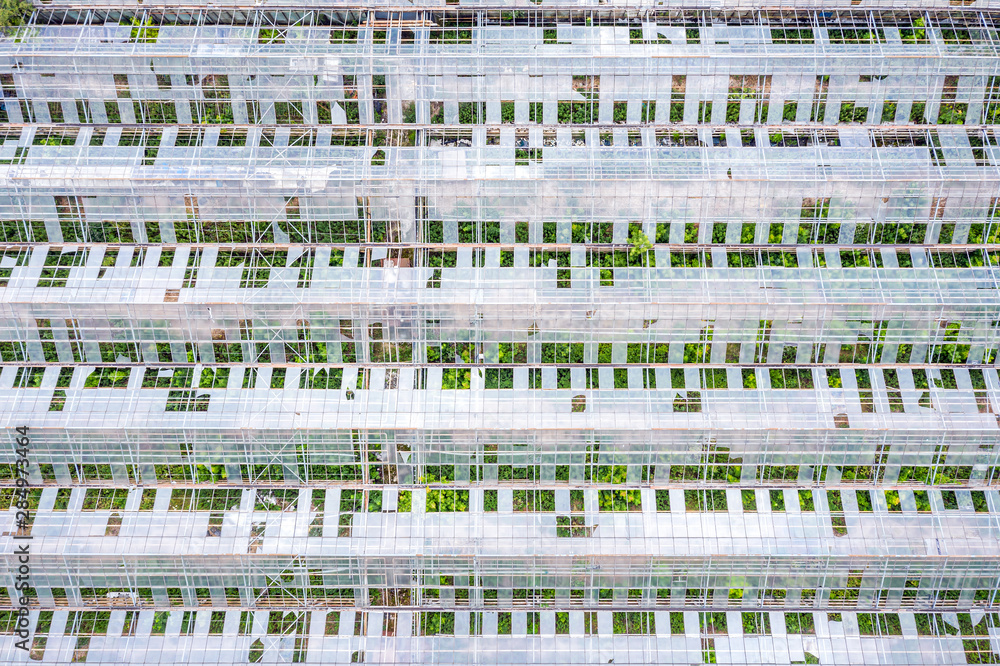 top view of old broken hothouse in countryside. aerial photography