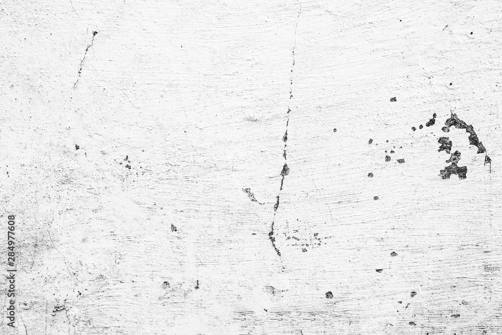 Fototapeta premium Texture of a concrete wall with cracks and scratches which can be used as a background
