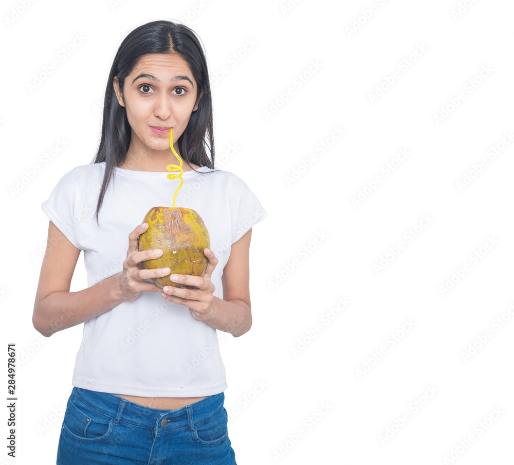Young asian girl drinking fresh coconut water from a straw Isolated on White Background, summer drink concept Young asian girl drinking fresh coconut water from a straw Isolated on White Background, summer drink concept