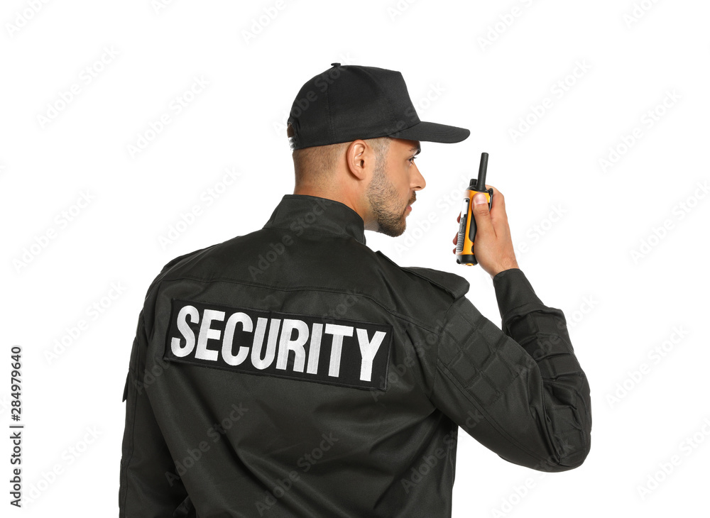 Male security guard in uniform using portable radio transmitter on white background Male security guard in uniform using portable radio transmitter on white background