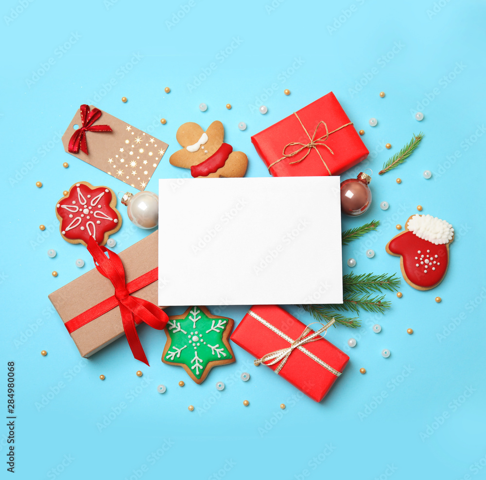 Obraz premium Flat lay composition with Christmas decor on blue background