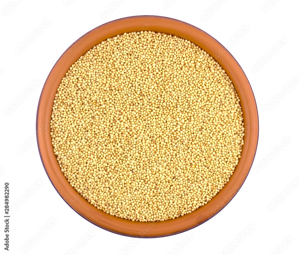 Amaranth grain in ceramic bowl isolated on a white background. Amaranth grain in ceramic bowl isolated on a white background.