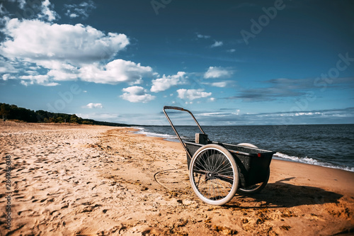  wheelbarrow by the sea on the beach