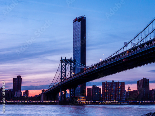 View to New York Manhattan at dusk in colorful impression