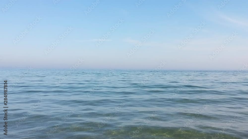 Mesmerising view of blue water with calm waves on it Mesmerising view of blue water with calm waves on it