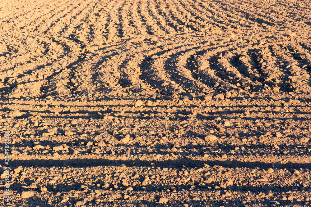 ploughed field or arable land with textured pattern after burying ploughed field or arable land with textured pattern after burying
