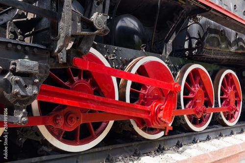 Vintage steam locomotive. The steam locomotive wheels close-up