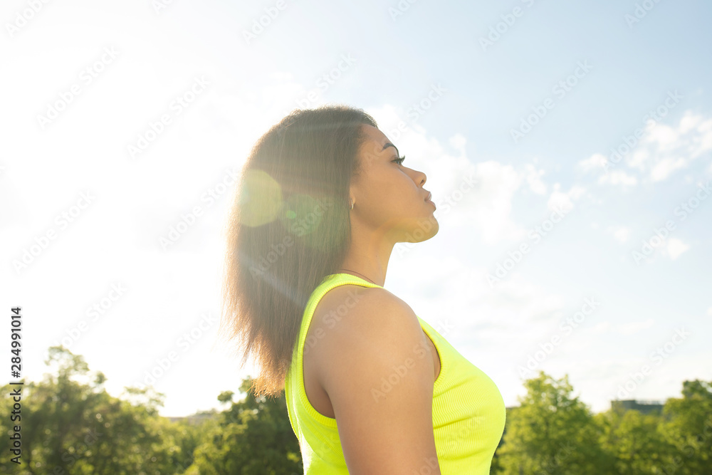Close up portrait of a beautiful young african american woman smiling and looking up. Close up portrait of a beautiful young african american woman smiling and looking up.