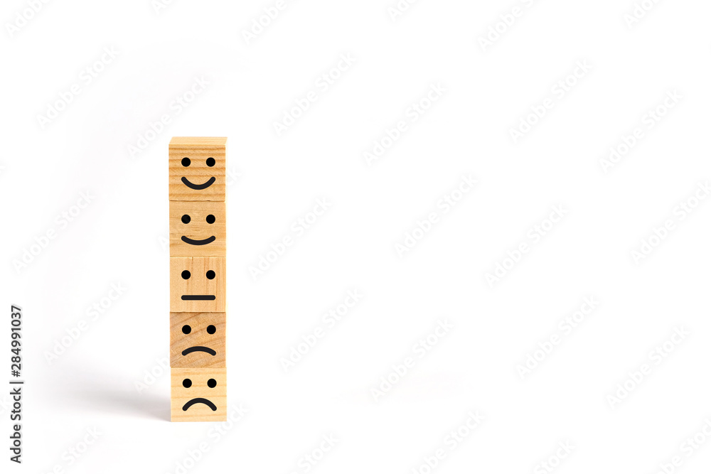 Customer service evaluation and survey concept with wooden block stacked vertically