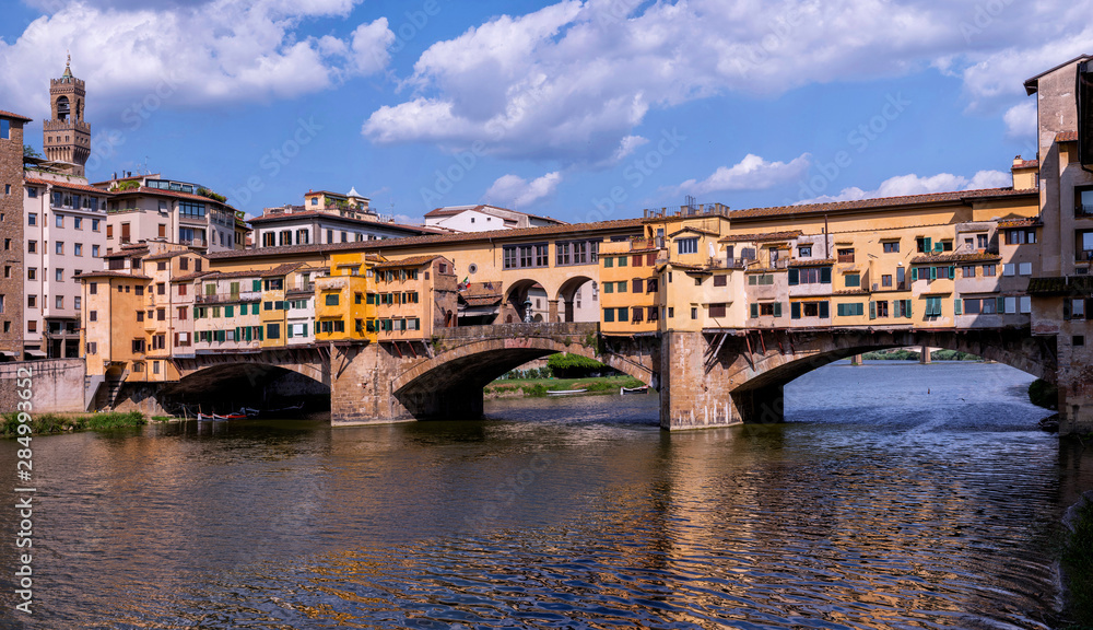 Panoramic view of Ponte Vecchio, with the Palazzo Vecchio tower in the background