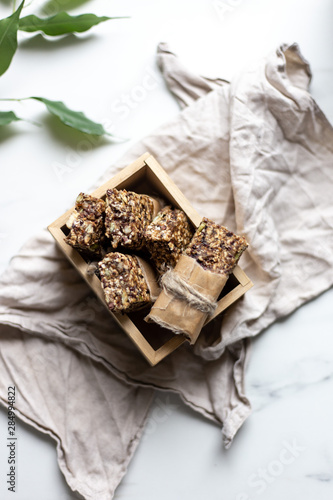 Granola bar. Healthy snack on marble background with copy space