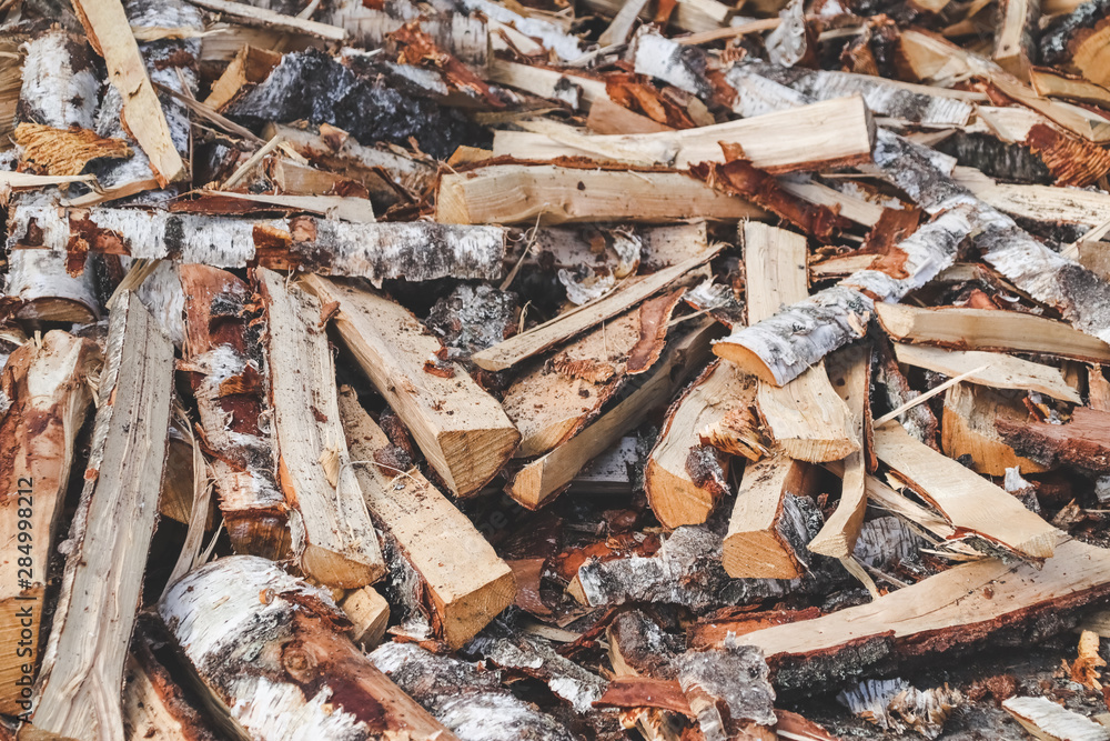 Pile of drying split firewood ready for the winter Pile of drying split firewood ready for the winter