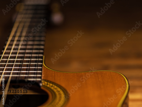 CLassic wooden guitar body close-up view