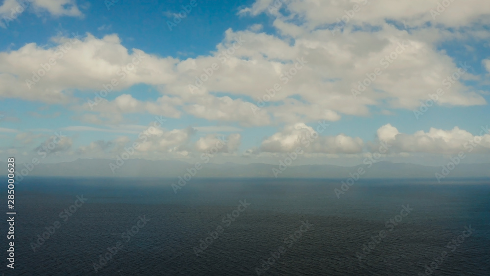 Blue sea surface and tropical islands Pescador, top view. Blue sea surface with waves. Moalboal, Philippines Blue sea surface and tropical islands Pescador, top view. Blue sea surface with waves. Moalboal, Philippines