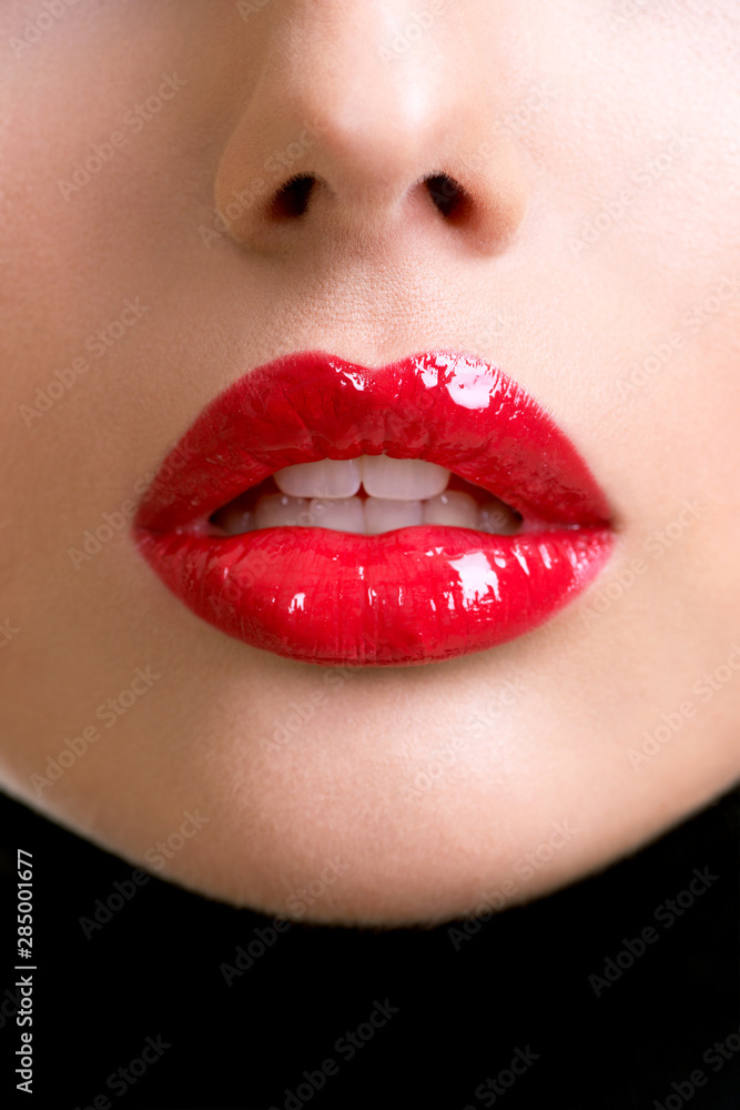 Closeup beautiful female lips with red lipstick. Closeup beautiful female lips with red lipstick.