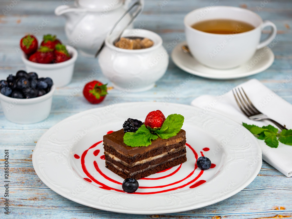 A slice of chocolate cake. Restaurant serving. A slice of chocolate cake. Restaurant serving.