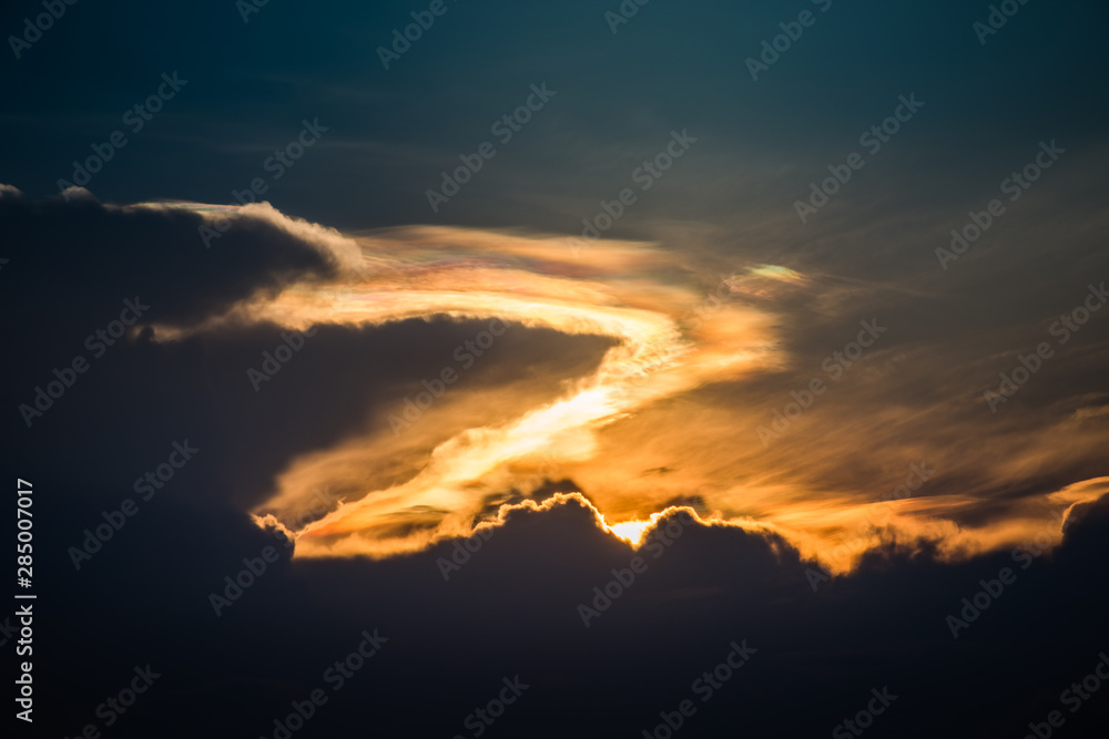 Beautiful iridescent cloud, Irisation or rainbow cloud on sky