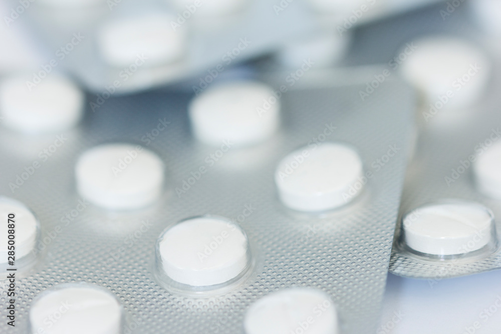 Macro photo of white prescription tablets Macro photo of white prescription tablets