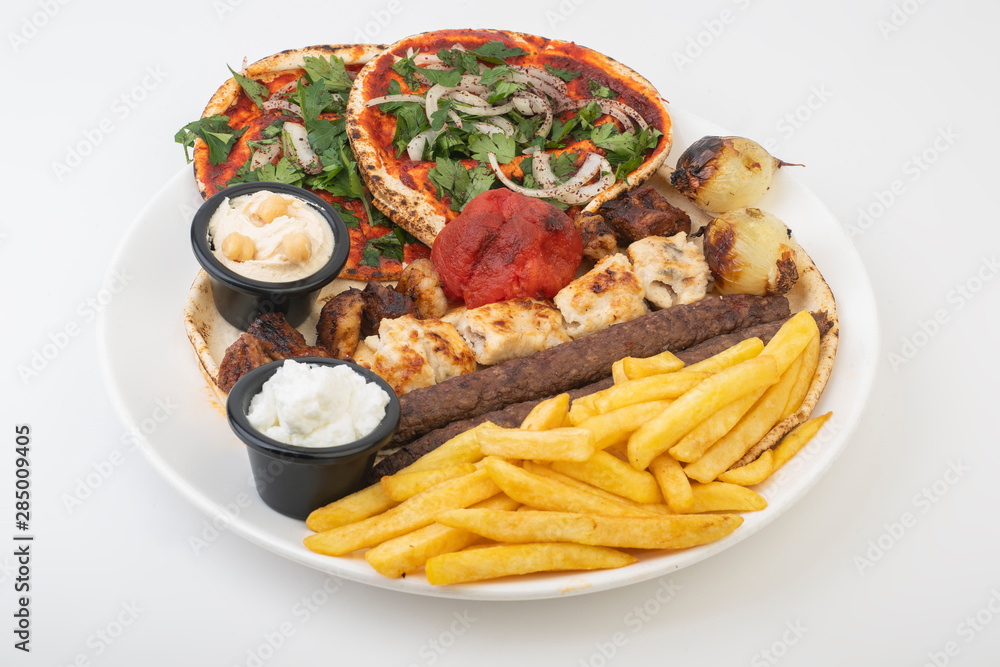 Lebanese Mixed Grill plate isolated on white. Lebanese Mixed Grill plate isolated on white.