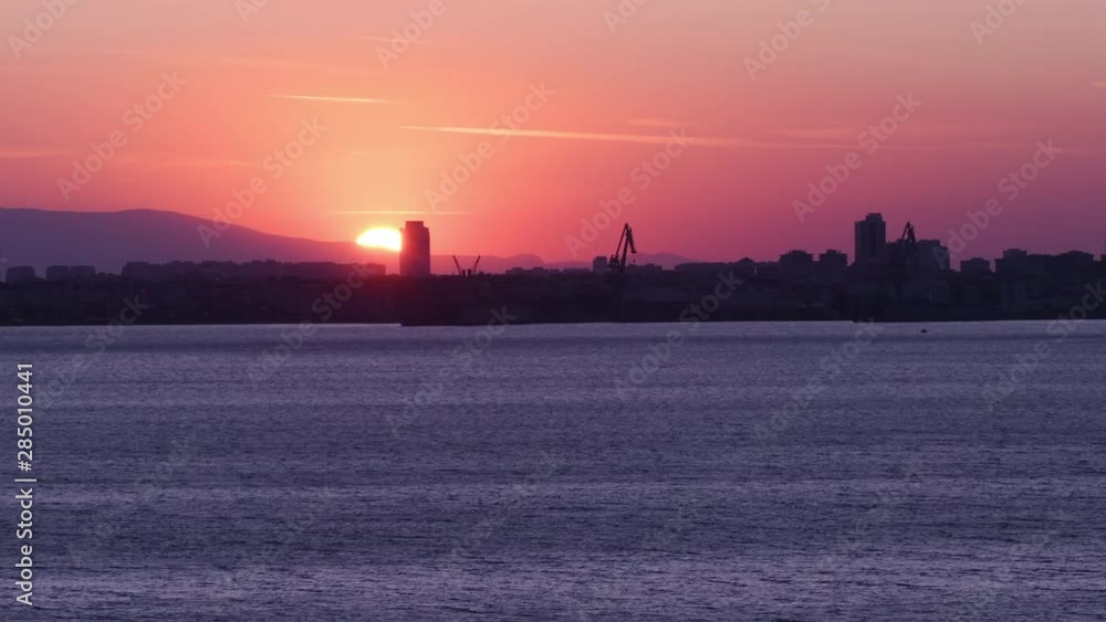 Sunset time lapse view of the mountains and skyline of Karsiyaka district in Izmir in Western Turkey. Sunset time lapse view of the mountains and skyline of Karsiyaka district in Izmir in Western Turkey.
