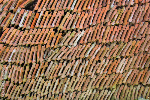 Stack of roof tiles, bricks arranged, full frame