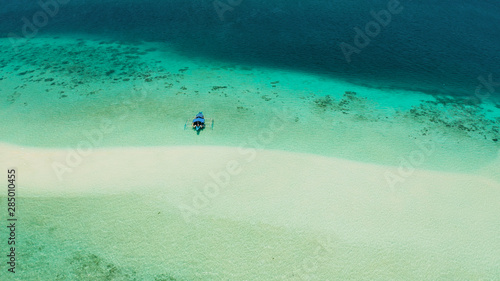 Sand bar in transparent turquoise water top view. Tropical beach with tourists. Mansalangan sandbar, Balabac, Palawan, Philippines. Summer and travel vacation concept © Alex Traveler