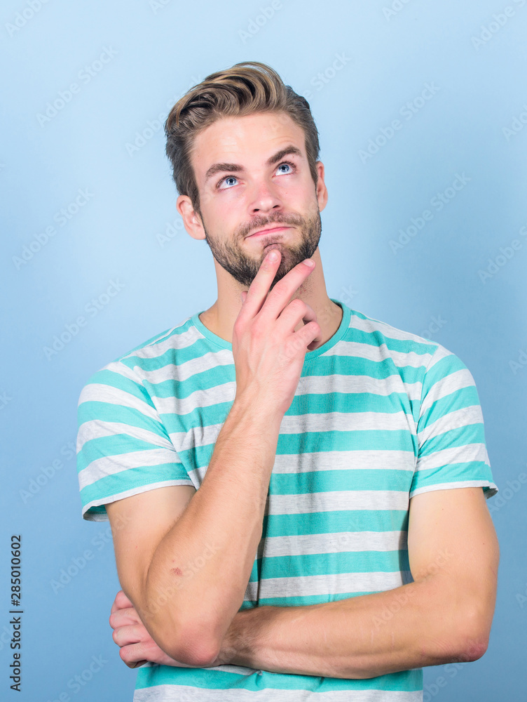 Hard question. Man serious face thoughtful. Have some doubts. Hipster bearded face not sure in something. Thoughtful man on blue background. Thoughtful expression. Need to think. Find solution Hard question. Man serious face thoughtful. Have some doubts. Hipster bearded face not sure in something. Thoughtful man on blue background. Thoughtful expression. Need to think. Find solution