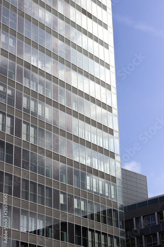 Modern office glasses buildings cityscape under blue clear sky.