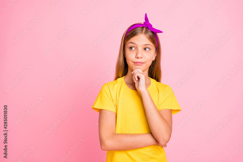 Close-up portrait of her she nice-looking attractive pretty shine creative pre-teen girl wearing yellow tshirt creating solution isolated over pink pastel background Close-up portrait of her she nice-looking attractive pretty shine creative pre-teen girl wearing yellow tshirt creating solution isolated over pink pastel background