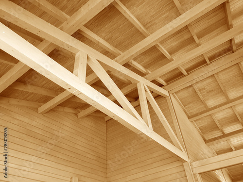 The construction of a wooden roof made of timber. © Denis Rozhnovsky