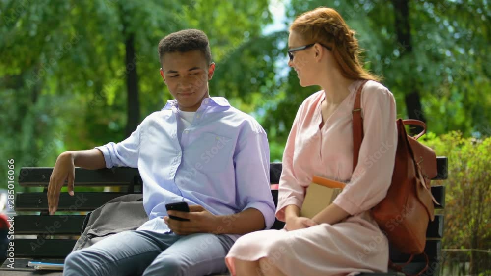 Self-confident teenager rejecting red-haired girl, first love relationship Self-confident teenager rejecting red-haired girl, first love relationship